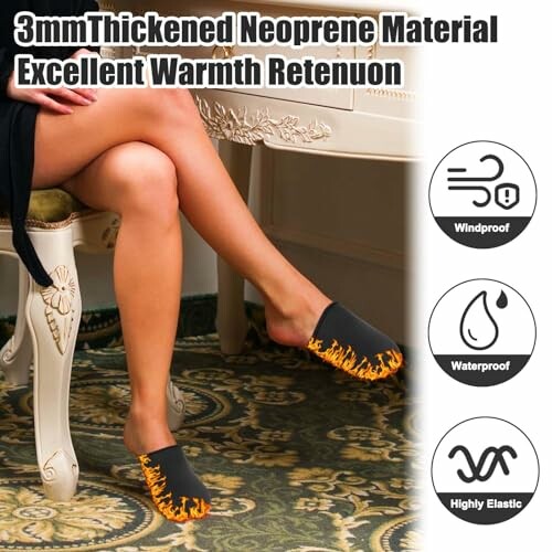 Person wearing neoprene slippers with flame design, highlighting features like windproof, waterproof, and highly elastic.