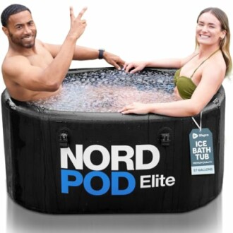 Two people in a NordPod Elite ice bath tub filled with water.