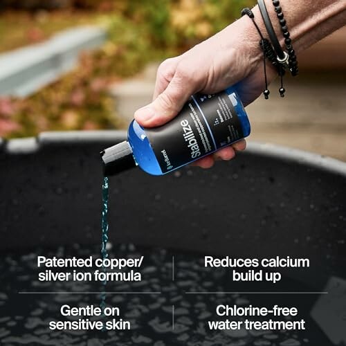 Hand pouring blue liquid pool stabilizer into water.