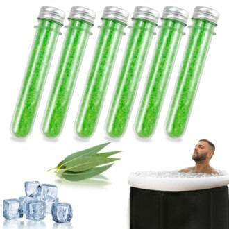 Green bath salt test tubes with eucalyptus leaf, ice cubes, and person in ice bath.