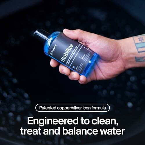 Hand holding a blue bottle labeled 'Stabilize' for water treatment.